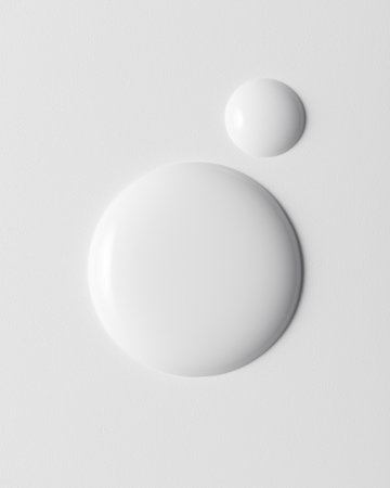 White product drops on white background. Clean minimal beauty texture concept symbolizing purity, hydration and modern design.の写真素材