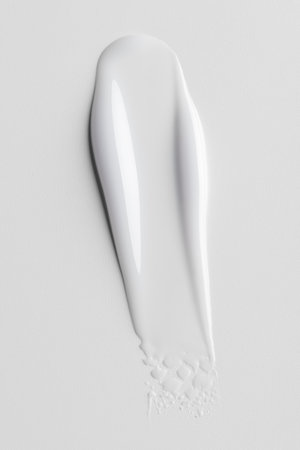 White cosmetic cream texture on clean background. Minimal skincare concept symbolizing softness, hydration, purity, and modern beauty product design for selfcare and wellness.の写真素材