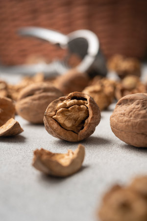 Walnuts with scattered shells. Still life concept of natural food, simplicity, and healthy...