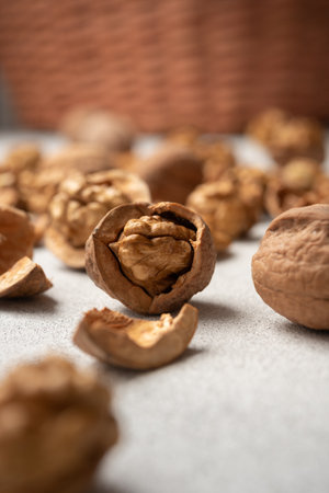 Walnuts with scattered shells. Still life concept of natural food, simplicity, and healthy...