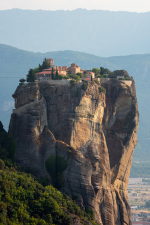 Stunning landscape of Meteora, Greece, featuring dramatic rock formations, historic monasterie.