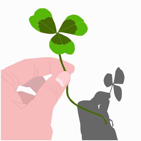 three leaf clover in handの写真素材