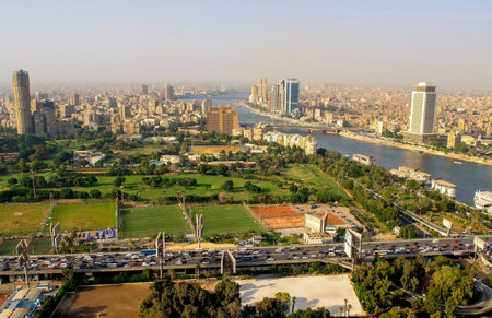 Cairo-Egypt - October 04, 2020: Beautiful city overview from Cairo Tower and car traffic during day. Panorama of Cairo cityscape with Nile river. Al Zamaler - Omar Al Khayamのeditorial素材