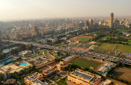 Cairo-Egypt - October 04, 2020: Beautiful city overview from Cairo Tower and heavy car traffic on a highway. Panorama of Cairo cityscape with Nile river.のeditorial素材