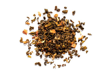 Dried tea leaves isolated on white background. Mix of black tea with fruits.