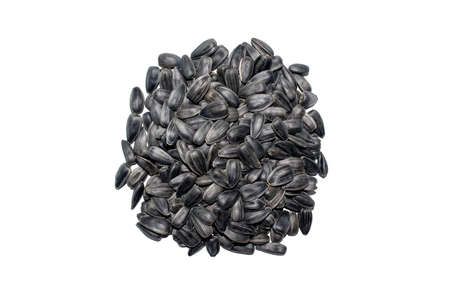 Heap of black fresh sunflower seeds isolated on white background. Top view.