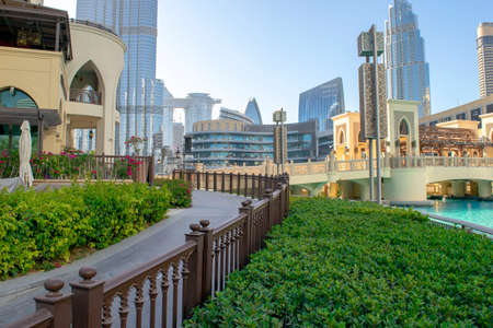 Dubai / UAE - May 12, 2020: Beautiful walkway leading to Souk al Bahar, Dubai fountain with Burj Khalifa and Dubai Mall bridge. Famous tourist attraction is empty and calm during lockdownのeditorial素材
