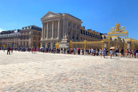 Versailles / France - July 6, 2019: Extremely huge queue of tourists in Palace of Versailles waiting...