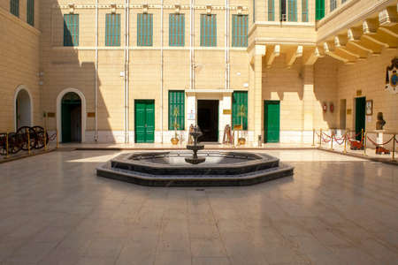 Cairo - Egypt - October 4, 2020: Abdeen Palace and museum entrance with inner courtyard with old cannons and fountain. Facade of Abdeen Royal Palace, located in Eastern Downtown of the city.のeditorial素材