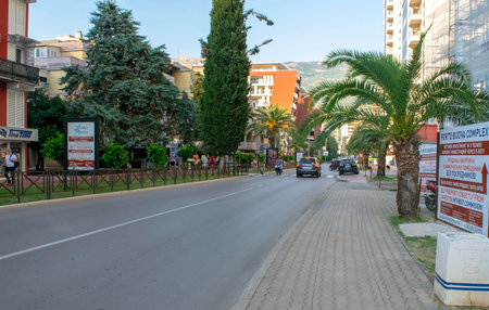 Montenegro - Budva: September 6, 2021: Beach main street and road in Budva city. Touristic town with residential buildings and hotelsのeditorial素材