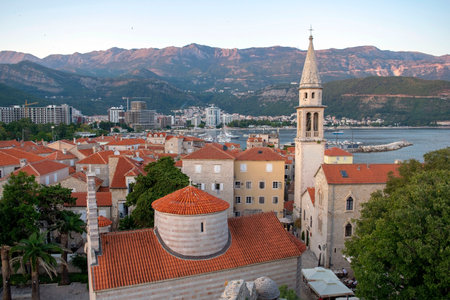 Montenegro - Budva: September 6, 2021: Aerial view of old town of Budva, Adriatic sea and mountains. View of walled city with Citadelのeditorial素材