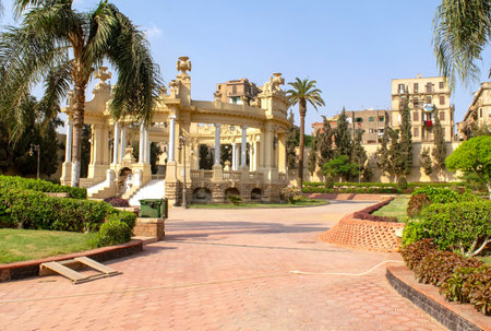 Cairo - Egypt - October 4, 2020: Presidency museum entrance with alley in the inner courtyard with old cannons. Facade of Abdeen Royal Palace, located in Eastern Downtown of the city. Garden.のeditorial素材