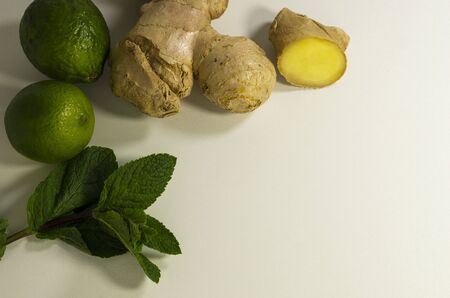 Detox tea supplement. Ginger root, mint and lime. Light background, copy space.の写真素材