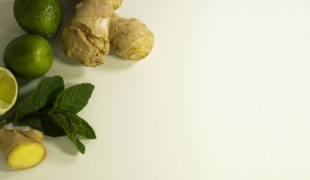 Tea supplement ginger root, peppermint leaves and lime fruit. Copy space.の写真素材