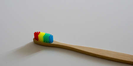 LGBT concept. Close up of a Bamboo Rainbow Dental Toothbrush.の写真素材