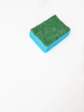 Blue dish sponge on a white background. Space for text. High quality photoの写真素材