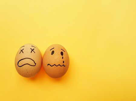 Chicken yellow eggs on a bright yellow background. Space for text. High quality photo