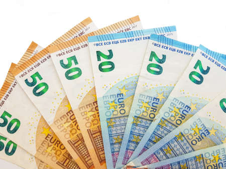 Paper money of the euro on a white background neatly laid out, straight, smooth. Denomination twenty, ten, fifty, five euros. Savings. Saving. Credit. Spare pillow for a rainy day. . High quality photoの写真素材