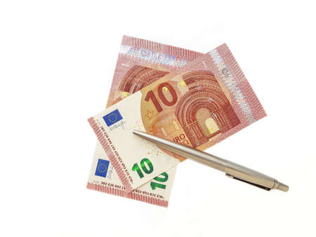Euro banknotes denomination ten with a metal silver handle on a white background. High quality photo
