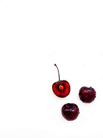 Bright ripe juicy cherry on a white background. A place for text. High quality photo