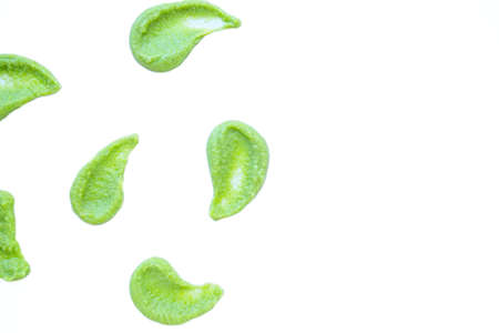 A drop of wasabi smeared on the surface on a white background is isolate. An artistic smear. High...