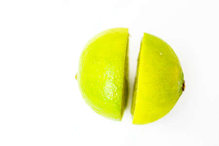 Bright juicy green lime on a white background cut in half. . High quality photoの写真素材