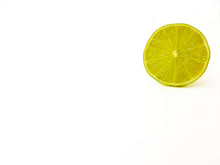 Bright juicy green lime on a white background cut in half. . High quality photoの写真素材