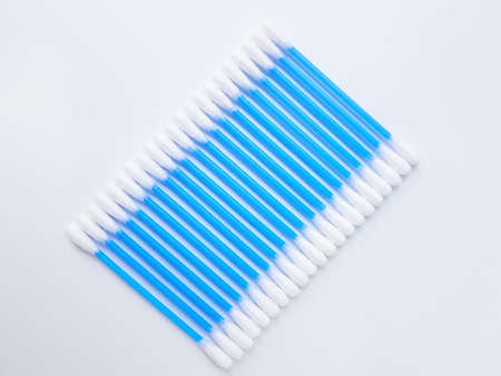Ear sticks with blue plastic on a white background. Personal hygiene and self-care. Cosmetology and...