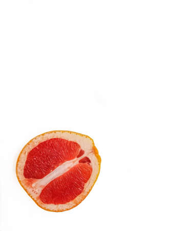 Red ripe juicy grapefruit in a cut on a white background view from above. The concept of diet and healthy eating. A place for text. . High quality photoの写真素材