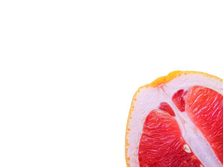 Red ripe juicy grapefruit in a cut on a white background view from above. The concept of diet and healthy eating. A place for text. . High quality photoの写真素材