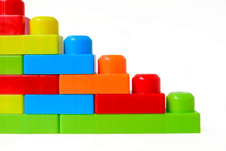 Bright multi-colored childrens designer on a white background. Interesting educational games for children. Place for text. High quality photoの写真素材