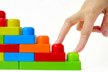 Step by step to the top. Business concept of successful financial growth. The womans hand steps on...