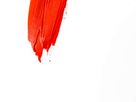 A smear of red paint on a white background. A place for text. . High quality photo