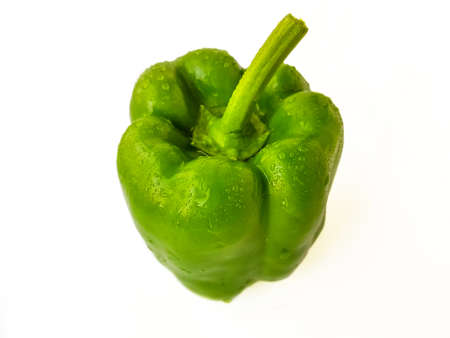 Green bell pepper on a white background. The concept of a healthy diet. . High quality photo
