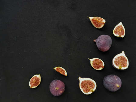 Bright juicy ripe figs on a dark background. High quality photo