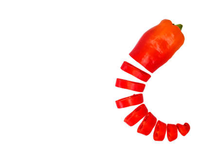 Red fresh pepper cut into equal parts of the ring on a white background. High quality photoの写真素材