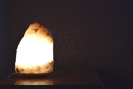Included salt lamp on the table at night.