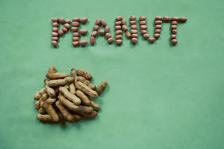 A bunch of unpeeled peanuts and the inscription