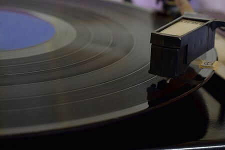 Old player of the 80's with a vinyl record.