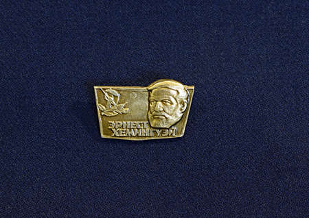 Bakhmut, Ukraine, April, 2021. Soviet badge depicting the writer Hemingway.のeditorial素材