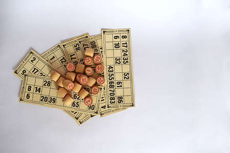 Loto cards and chips on a white background, top view.の写真素材