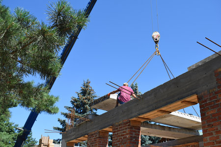 Laying concrete floor slabs using a self-propelled crane.の写真素材