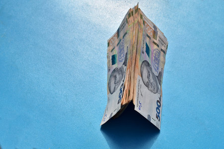 Stacks of Ukrainian banknotes are stacked like a houseの写真素材