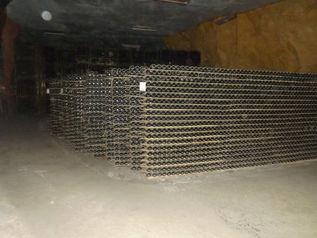 Stacks of sparkling wine bottles in the post-production aging shop.