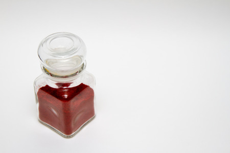glass jar for spice with red paprikaの写真素材