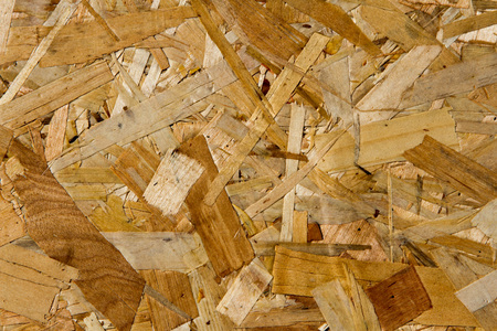 OSB sheet structure with large patches of sawdust and shavings