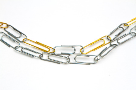 stationery multicolored paper clips on a white backgroundの写真素材