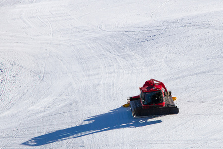 snowcat on ski slopes in the early morningの写真素材