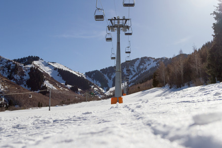 ski slope with ski lifts in Kazakhstanの写真素材