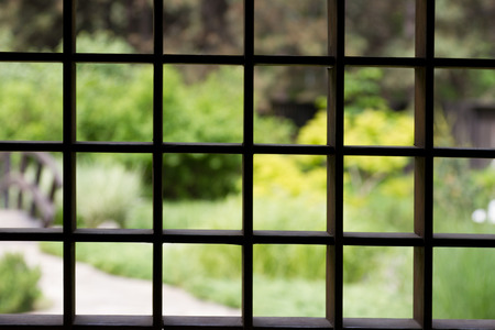 wooden lattice on the window with a blurred backgroundの写真素材